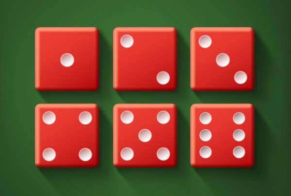 Top view of a set of red casino dice on a green table